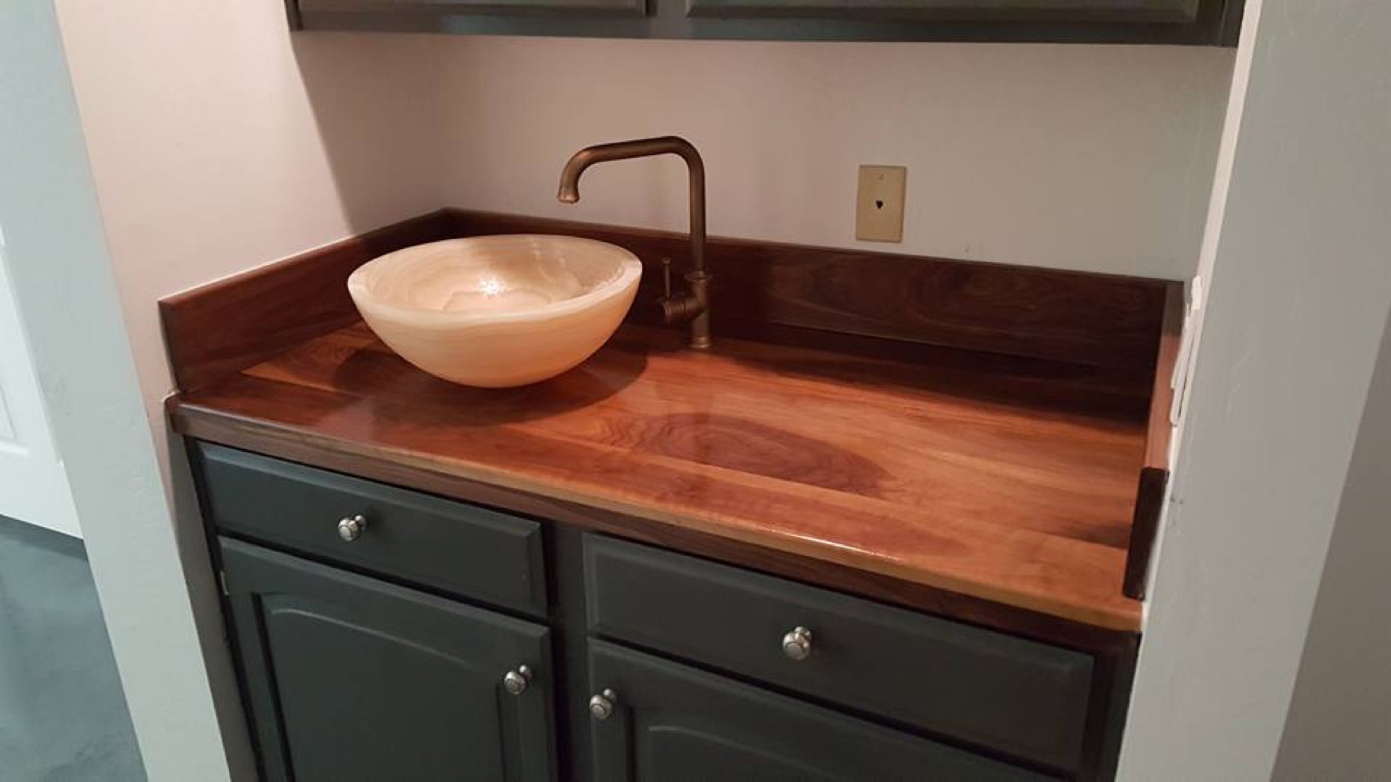 Custom wood vanity countertop with a vessel sink