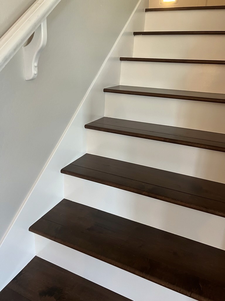 Finished staircase with custom wood treads and risers